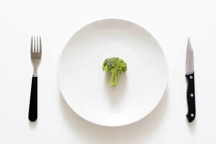 A broccoli on a plate, can be used for health theme