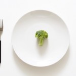 A broccoli on a plate, can be used for health theme